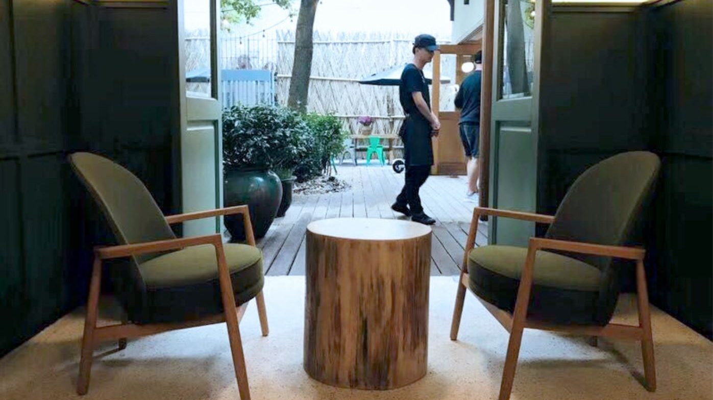 round upholstered timber framed lounge chair